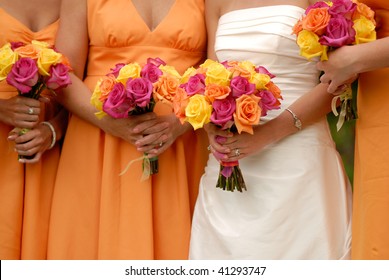 Bride and Bridesmaids holding Bouquets