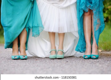 Bride and bridesmaids show off their shoes at wedding - Powered by Shutterstock