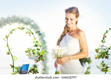 Bride In A Flourish Arch On The Wedding Venue, Bali