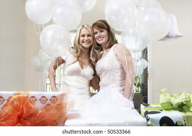 Bride and Friend standing Together holding balloons at Bridal Shower - Powered by Shutterstock