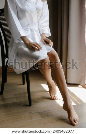 The bride is getting ready in the room