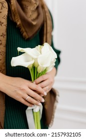 Bride In Green Knitt Kness Holding A Bouqet Of Calla Lilies