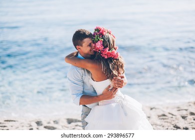 Bride and groom by the sea on their wedding day