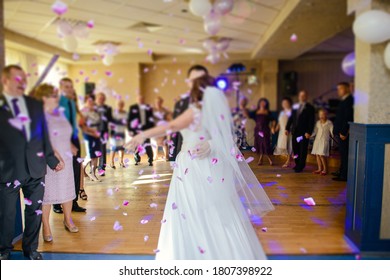 Bride And Groom Dancing The First Dance At Their Wedding Day. Guest On The Dancefloor