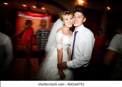 Bride And Groom Dancing Motion On Dance Floor During Wedding Reception In  Restaurant.