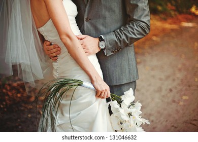 Bride and groom embrace each other