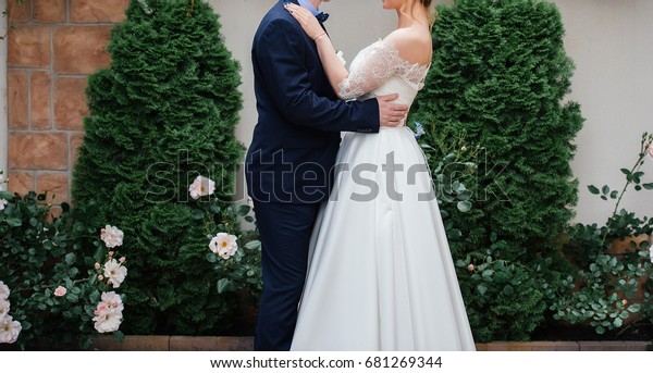 Bride Groom Embracing Near Rose Bush Stock Photo Edit Now 681269344