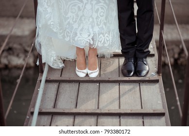 Bride and Groom Feet Standing on Wooden Floor