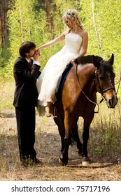 Bride and groom in forest with horses