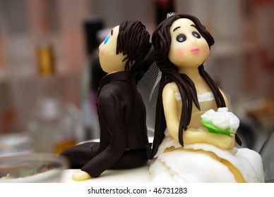 Bride And Groom Funny And Sugar Figures On Wedding Cake