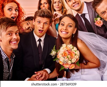 Bride And Groom And Guests In Photobooth. Wedding.