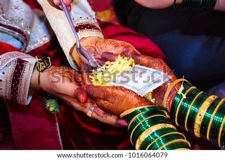 Bride and groom at Haldi ceremony a couple days before a Hindu wedding