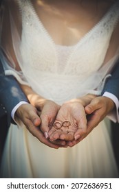 Bride And Groom Hands Close Together Show Customized Golden Marriage Rings