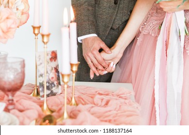 Bride And Groom Hold Hands
