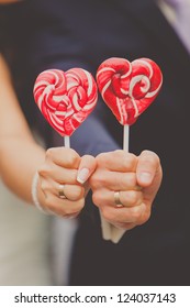 Bride And Groom Holding Candy Heart