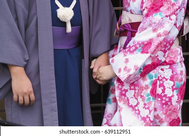 bride and groom holding hands after they got mmarried and the wear kimono (Japanese style)