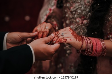 Bride And Groom Holding Hands At Their Wedding In Pakistan