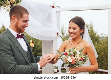 Bride and groom irish style on wedding ceremony in country village house. Happy couple young family on wed day. Happy female and cute groom. Concept of marriage registration office and luxury married