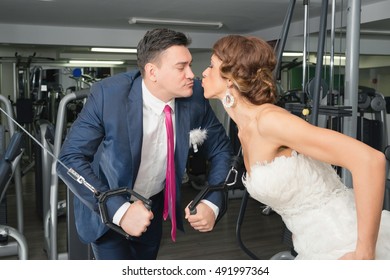 Bride And Groom Kissing In Gym