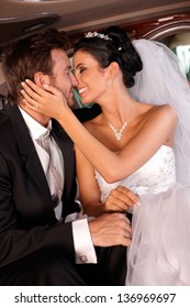 Bride And Groom Kissing In Limousine, Embracing.