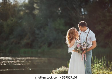 The Bride And Groom In Nature. Rustic Wedding