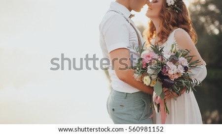 the bride and groom on the background of a mountain stream