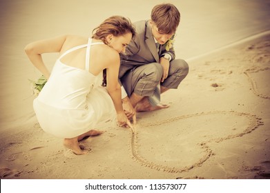 Bride And Groom On The Beach