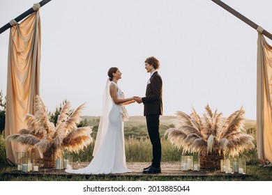 Bride and groom on their wedding ceremony - Powered by Shutterstock