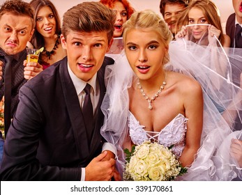 Bride And Groom In Photobooth Making Wedding Pictures. .