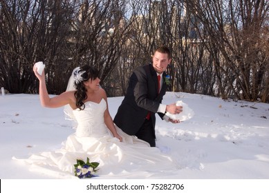 Bride And Groom Playing Snow Fight