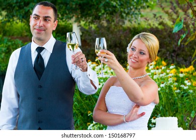 A Bride And Groom Share A Moment Together While The Best Man And Maid Of Honor Toast Them At Their Wedding Reception.