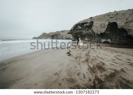 Similar – Image, Stock Photo Couple looking at the sea