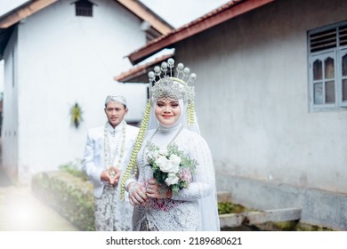 Bride And Groom Wearing White Javanese Traditional Clothes, Indonesia July 27, 2022