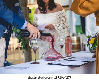 Bride And Groom In Wedding Ceremony, Groom Serving Wine In Glasses