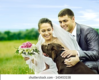 Bride and groom wedding with dog summer outdoor.