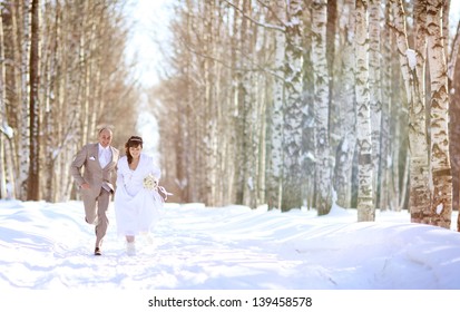 Bride And Groom In The Winter Woods