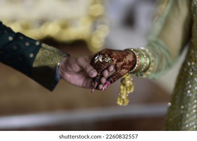 Bride and Groom's Hand Being Tied Together Before the Wedding Rituals