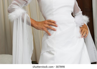 Bride with hands on hips