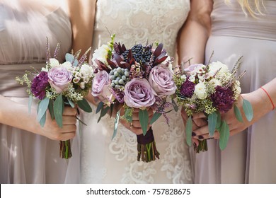 bride with her bridesmaids holding wedding bouquets - Shutterstock ID 757828675