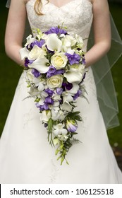 Bride Holding A Large Teardrop Wedding Bouquet