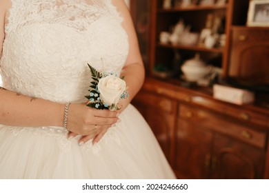 A Bride Holding A Small Wedding Bouquet