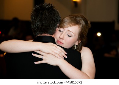 A Bride Hugs Her Father At The End Of The Father Daughter Dance At Her Wedding Reception.