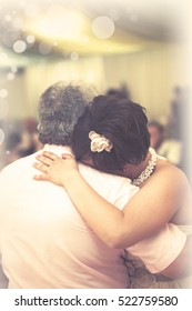 A Bride Hugs Her Father At The End Of The Father Daughter Dance At Her Wedding Reception