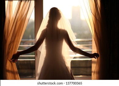 Bride Looking Through The Window 