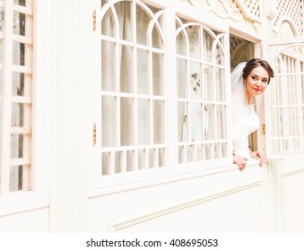 bride looking through the window