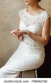 the bride looks at the ring