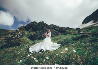 https://image.shutterstock.com/image-photo/bride-mountains-wedding-260nw-439988386.jpg