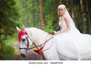  bride on a horses in the forest