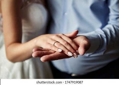 Bride on wedding day holding her father's hands. Concept of relationship between dads and daughters - Shutterstock ID 1747919087
