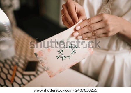 The bride packs an envelope